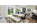 Open concept dining area with white table and bench seating at 5055 Beargrass Dr, Dallas, NC 28034