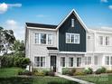 Two-story home with white and navy siding and landscaping at 5684 Clear Creek Ln, Charlotte, NC 28215
