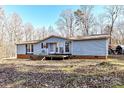 Ranch style home with deck and wooded backdrop at 8327 Walkup Rd, Waxhaw, NC 28173