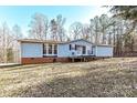 Ranch style home with deck and wooded backdrop at 8327 Walkup Rd, Waxhaw, NC 28173