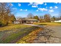 Front view of a charming ranch house with a spacious yard at 111 Lois Ct, Statesville, NC 28625