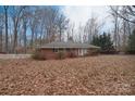 Ranch house with a white picket fence and leafy yard at 16523 Clear Creek Dr, Midland, NC 28107