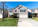 Two-story house with gray siding, red shutters, and a two-car garage at 2138 Durand Rd, Fort Mill, SC 29715