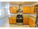 Kitchen with wood cabinets, stainless steel appliances, and tile flooring at 2138 Durand Rd, Fort Mill, SC 29715