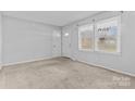 Bright living room with neutral carpeting at 800 Peachtree Rd, Charlotte, NC 28216