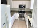 Modern kitchen with stainless steel appliances and granite countertops at 14243 Richmond Park Ave, Charlotte, NC 28277