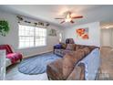 Spacious living room featuring a brown sectional sofa and large window at 2151 Pacer Rd, Lancaster, SC 29720