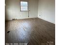 Spacious living room with light brown laminate flooring at 2700 W C St, Kannapolis, NC 28081