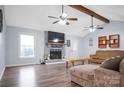 Spacious living room with a fireplace, hardwood floors, and ceiling fan at 405 Stony Point Rd, Kings Mountain, NC 28086