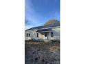 Front view of a yellow house at 409 Flint St, Gastonia, NC 28054