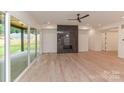 Spacious living room with fireplace, hardwood floors, and sliding doors to patio at 0003 Mission Church Rd, Locust, NC 28097