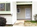 Condo building entrance with walkway and green bushes at 1646 Eagles Pl # H 101, Rock Hill, SC 29732