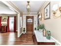 Bright and spacious entryway with hardwood floors and a marble console table at 4511 Twin Oaks Pl, Charlotte, NC 28212