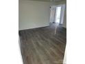 Bright living room featuring gray laminate flooring at 111 Dye St, Chester, SC 29706