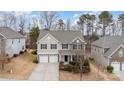 Two-story house, stone accents, two-car garage, neighborhood view at 4836 Pepper Dr, Harrisburg, NC 28075
