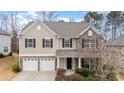 Two-story house with stone accents and a two-car garage at 4836 Pepper Dr, Harrisburg, NC 28075