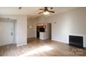 Open living room and kitchen with hardwood floors and neutral colors at 8121 #E Tremaine Ct, Charlotte, NC 28227