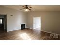 Living room with hardwood floors, fireplace, and vaulted ceiling at 8121 #E Tremaine Ct, Charlotte, NC 28227