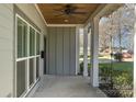 Covered front porch with ceiling fan and white columns at 419 Sylvania Ave, Charlotte, NC 28206