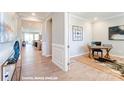 Bright entryway with view into home office and living area at 9931 Cask Way, Huntersville, NC 28078