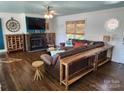 Cozy living room featuring a fireplace and hardwood floors at 1430 Mollys Backbone Rd, Catawba, NC 28609