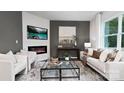 Spacious living room featuring a modern fireplace and large windows at 5051 Beargrass Dr, Dallas, NC 28034