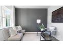 Bright home office features a glass desk, comfortable chairs, and large wall at 5145 Fireweed Ct, Dallas, NC 28034