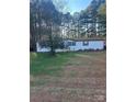 White mobile home with a large yard at 246 Barbary Dr, Statesville, NC 28677