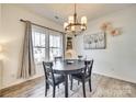 Dining room with dark wood table and gray chairs at 932 Canopy Falls Ln, York, SC 29745