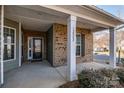 Front entrance with brick columns and a covered porch at 12002 Belmont Mansion Dr, Charlotte, NC 28273