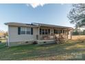 Beige house with covered porch and black shutters at 128 Tr Foster Rd, Kings Mountain, NC 28086