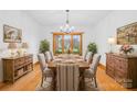 Formal dining room with hardwood floors and large windows at 2510 Burton Estates Ln, Lincolnton, NC 28092