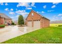 Two-car brick garage with a large driveway at 2510 Burton Estates Ln, Lincolnton, NC 28092