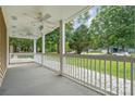 Covered porch with white railing overlooking backyard at 4004 Bon Rea Dr, Charlotte, NC 28226