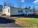 Single story home with large front yard at 816 Perry Rd, Troutman, NC 28166