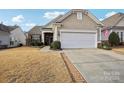 Ranch home with two-car garage and American flag at 15244 Legend Oaks Ct, Fort Mill, SC 29707