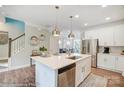 Modern white kitchen with stainless steel appliances and large island at 5552 Stafford Rd # 28, Charlotte, NC 28215