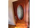 Elegant mahogany front door with oval glass window at 604 Eastwood Dr, Albemarle, NC 28001