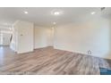 Spacious living room with hardwood floors and a fireplace at 2024 Embassy Ct # 49, Charlotte, NC 28213