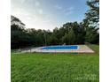 Inviting in-ground pool, perfect for summer fun at 6200 George Hildebran School Rd, Hickory, NC 28602