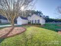 House exterior with tree and yard at 537 Scarlet Leaf Ln, Oakboro, NC 28129