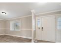 Bright entryway with white door and neutral wall colors at 155 Mcadam Ln, Mooresville, NC 28117