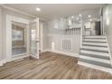 Living room with hardwood floors and access to the kitchen at 155 Mcadam Ln, Mooresville, NC 28117