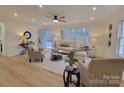 Light and airy living room with hardwood floors, neutral furniture and open floor plan at 301 W Hartford Ave, Bessemer City, NC 28016