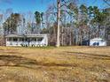 Gray ranch home on a spacious lot with a detached garage at 38899 Dalton Ln, Albemarle, NC 28001