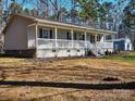 Ranch style home with large porch and detached garage at 38899 Dalton Ln, Albemarle, NC 28001
