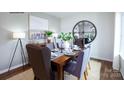 Formal dining room with hardwood floors and a large mirror at 1373 6Th Ne St, Hickory, NC 28601