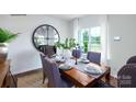 Bright dining room featuring hardwood floors and large windows at 1373 6Th Ne St, Hickory, NC 28601