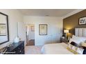 Well-lit bedroom with double doors and a large mirror at 8020 Plymouth Dr, Sherrills Ford, NC 28673
