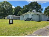 Blue church building with a cross on the roof, surrounded by a grassy yard at 3391 Briarwood Dr, Maiden, NC 28650